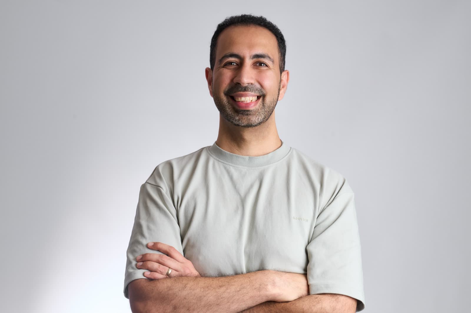 Farhad Malegam, founder of Dream Websites, standing with arms crossed