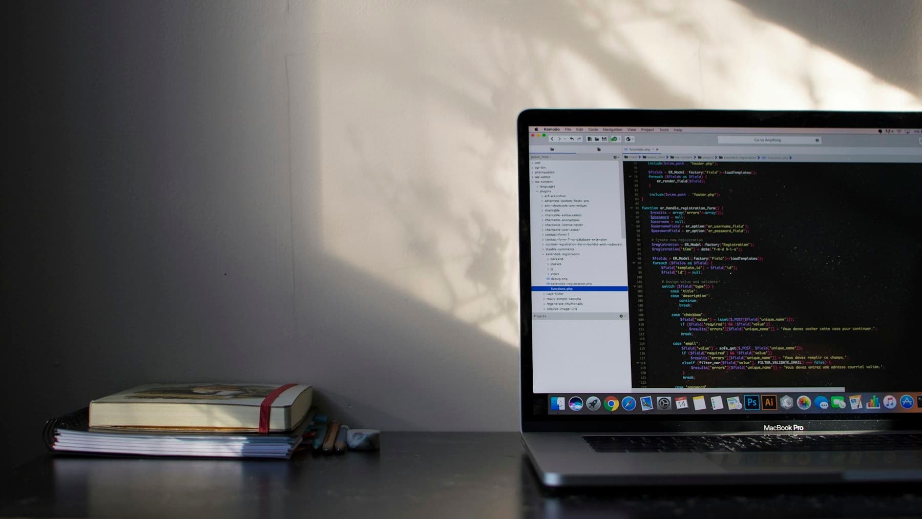 Developer's laptop showing code in soft daylight
